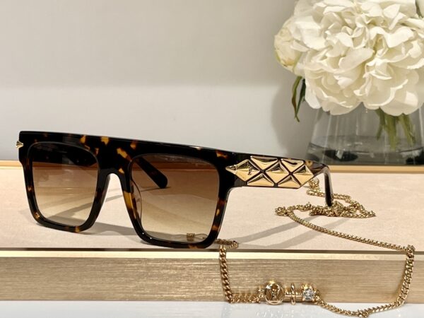 Lunettes de Soleil Louis Vuitton en Acétate Noir et Doré